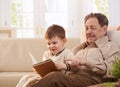 Grandfather and grandson together at home Royalty Free Stock Photo