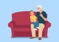 Grandfather and his grandson sitting on the sofa Royalty Free Stock Photo