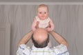 Grandfather holding a caucasian 8 month baby girl Royalty Free Stock Photo