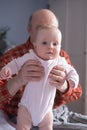 Grandfather holding a caucasian newborn baby girl Royalty Free Stock Photo