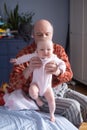 Grandfather holding a caucasian newborn baby girl Royalty Free Stock Photo