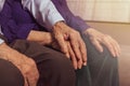 Grandfather holding grandmother`s hand. Support and care Royalty Free Stock Photo