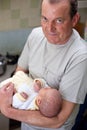 Grandfather holding his newborn grandson Royalty Free Stock Photo