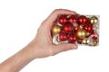 Grandfather holds in his hand plastic box with Christmas balls isolated