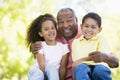 Grandfather laughing with grandchildren