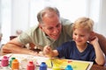 Grandfather Painting Picture With Grandson At Home Royalty Free Stock Photo