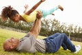 Grandfather Playing Game With Granddaughter In Park Royalty Free Stock Photo