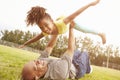 Grandfather Playing Game With Granddaughter In Park Royalty Free Stock Photo