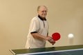 Grandfather playing ping pong