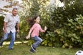 Grandfather Playing Soccer In Garden With Granddaughter Royalty Free Stock Photo