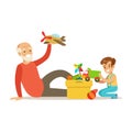 Grandfather Playing Toys With Boy, Part Of Grandparents Having Fun With Grandchildren Series