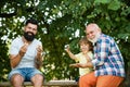 Grandfather portrait on blue sky backgrounds. Happy kids time. Happy three generations of men have fun and playing Chess