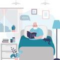 Grandfather read book in comfortable bed. Old man reading magazine in morning. Senior sits at home in bed with cat and enjoys