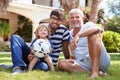Grandfather Sitting In Garden With Son And Grandson Royalty Free Stock Photo