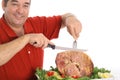 Grandfather slicing a ham