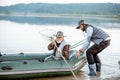 Grandfather with son fishing on the lake Royalty Free Stock Photo