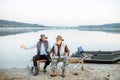 Grandfather with son fishing on the lake