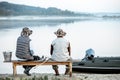 Grandfather with son fishing together Royalty Free Stock Photo