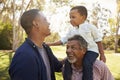 Grandfather With Son And Grandson Having Fun In Park Royalty Free Stock Photo