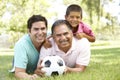 Grandfather With Son And Grandson In Park Royalty Free Stock Photo