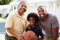 Grandfather With Son And Grandson Playing Basketball