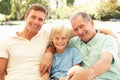 Grandfather, Son And Grandson Relaxing On Sofa Royalty Free Stock Photo