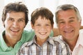 Grandfather with son and grandson smiling Royalty Free Stock Photo