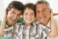 Grandfather with son and grandson smiling Royalty Free Stock Photo