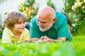 Grandfather with son in park. Grandfather and grandson Playing - Family Time Together. Father and grandfather. Happy Royalty Free Stock Photo