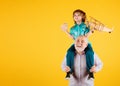 Grandfather and son piggyback ride with plane and wooden toy truck. Men generation granddad and grandchild. Elderly old