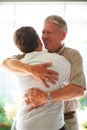 Grandfather, teenager and hug with smile, family and embrace with love, grandchild and home. Grandparent, support or