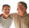 Grandfather, teenager and hug with smile, happy and embrace with love, grandchild and home. Grandparent, support or