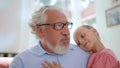 Grandfather telling fairy tail for granddaughter. Senior man gesturing with hand