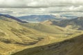 A grandiose mountain valley with low dark sky