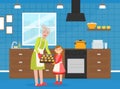 Grandma Baking Cookies with her Granddaughter, Elderly Woman Spending Time at Home with her Grandchild, Girl Stayed with Royalty Free Stock Photo