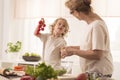 Grandma cooking with grandchild