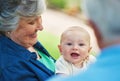 Grandma is crazy in love with me. a baby boy spending time outdoors with his grandmother. Royalty Free Stock Photo