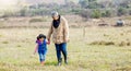 Grandma, girl and holding hands for walk on grass, family farm and bonding together with love outdoor. Old woman, child Royalty Free Stock Photo