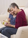 Grandma and Girl with Present Royalty Free Stock Photo