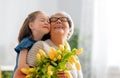 Grandma and girl smiling and hugging