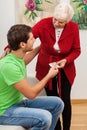 Grandma giving money to her grandson Royalty Free Stock Photo