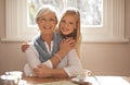 Grandma, grandchild and happiness with hug in portrait at nursing home for visit and conversation with love. Mature Royalty Free Stock Photo