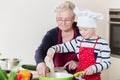 Grandma and grandson cooking together Royalty Free Stock Photo