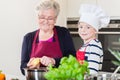 Grandma and grandson cooking together