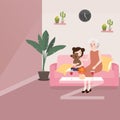 Grandma with her grand daughter sitting in sofa talking while playing teddy bear in living room telling story Royalty Free Stock Photo