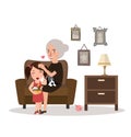 Grandma with her grand daughter sitting in sofa talking while playing teddy bear in living room telling story Royalty Free Stock Photo