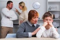 Grandma hugging upset boy during parental quarrel Royalty Free Stock Photo