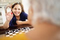 Grandma Playing Checkers Board Game With Granddaughter At Home Royalty Free Stock Photo