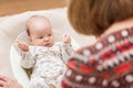 Grandma playing with her newborn baby Royalty Free Stock Photo