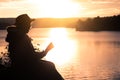 Grandma read a book in nature.